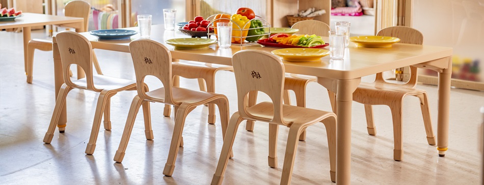 A preschool classroom with chairs and tables