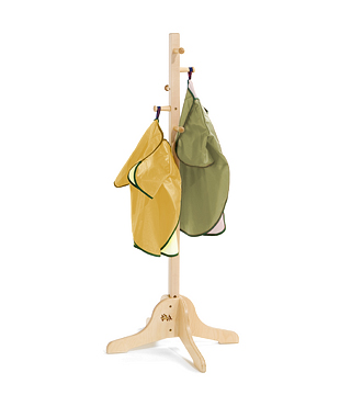 A green and a yellow apron on a rack