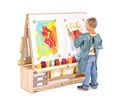 Boy with blue apron painting at an Art Island