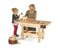 Child and teacher using a workbench