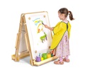 A child painting at a floor easel