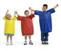 Three children wearing aprons