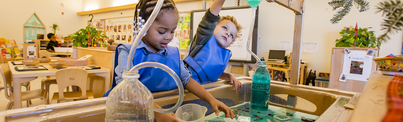 Children playing at water table