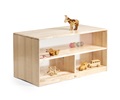 A low shelf with transparent back, containing toys and play material