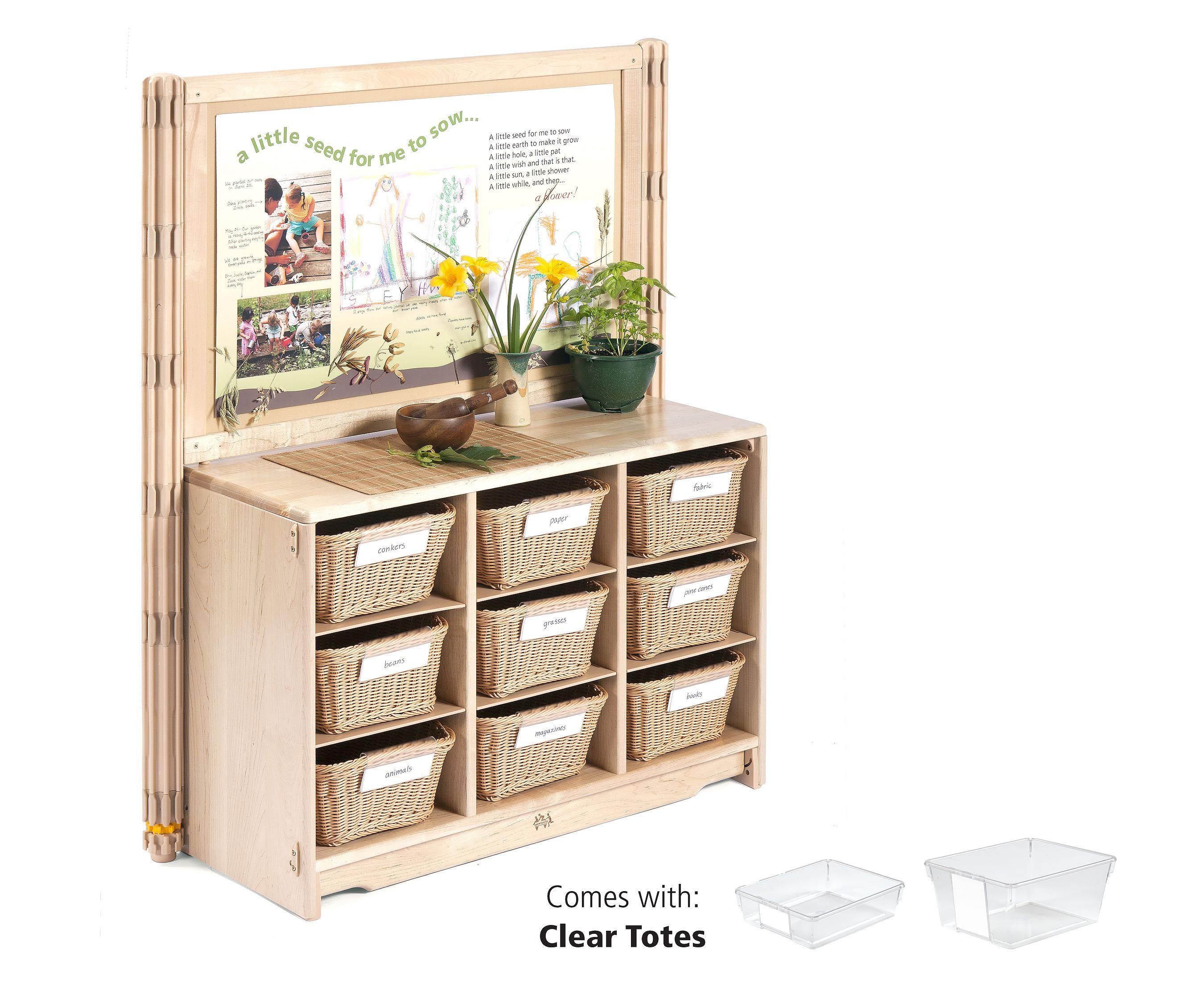 A wooden display unit with a nature-themed back panel, a countertop, and nine wicker baskets.