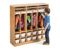 A boy is hanging up his jacket in Compact Preschool Cubby 6 with totes