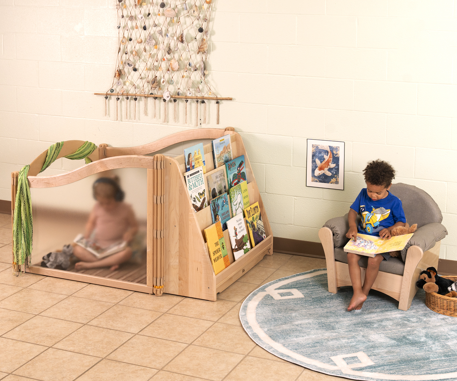 A Listening Cube against a wall beside a reading area.