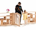 Teacher and child walking through Roomscapes Gateway