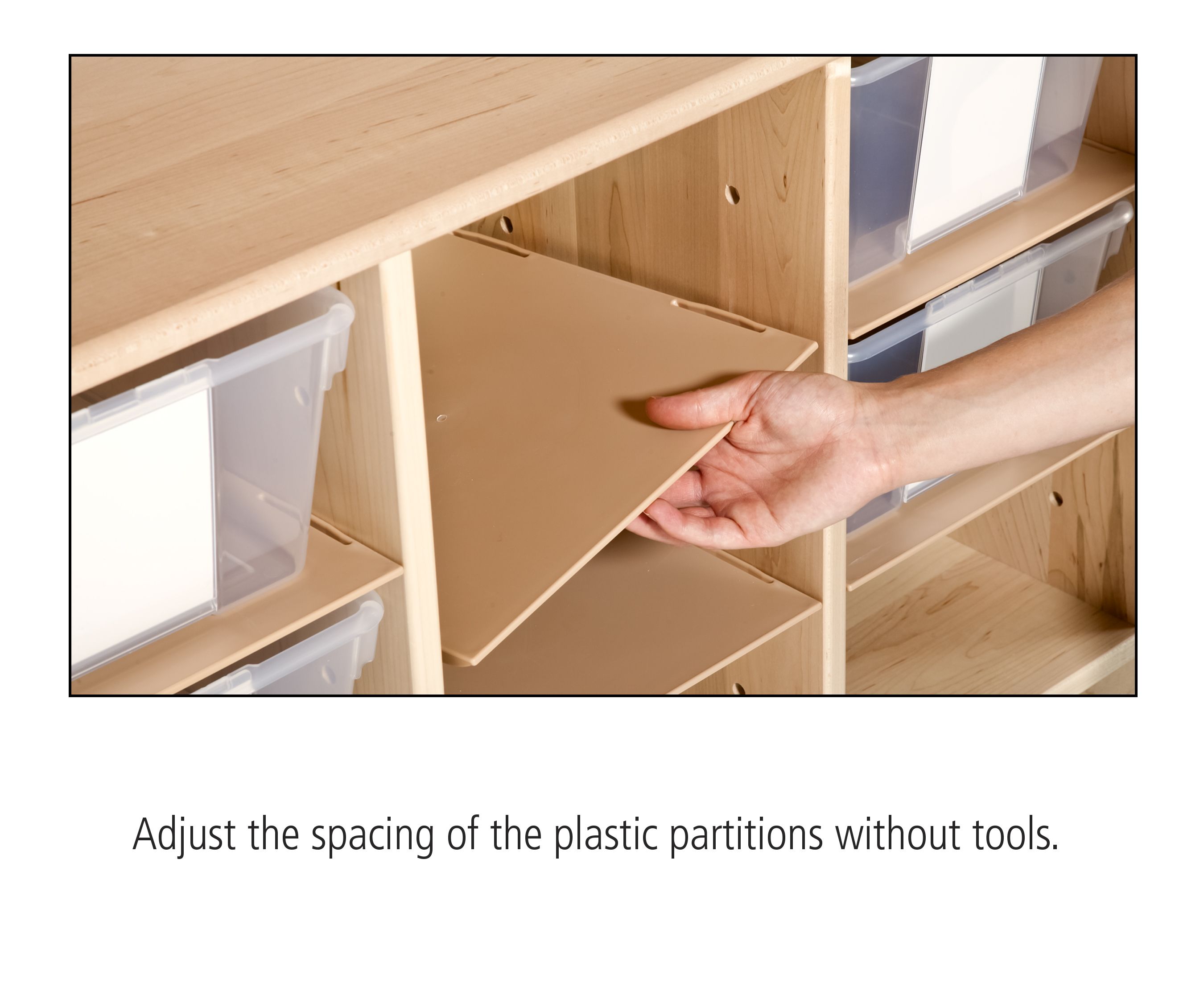 a hand demonstrating an adjustable shelf