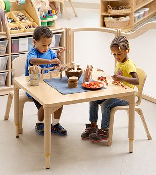 two children sitting at a table