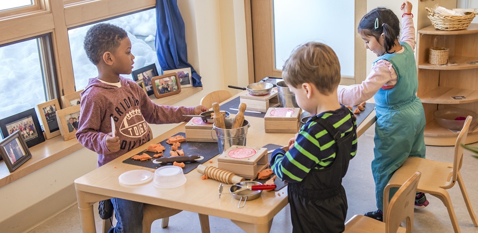 child playing at a table