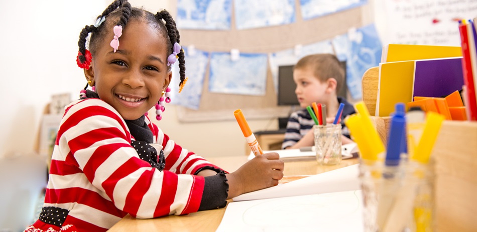 child playing at a table