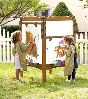 preschool girls painting at Outlast Easel