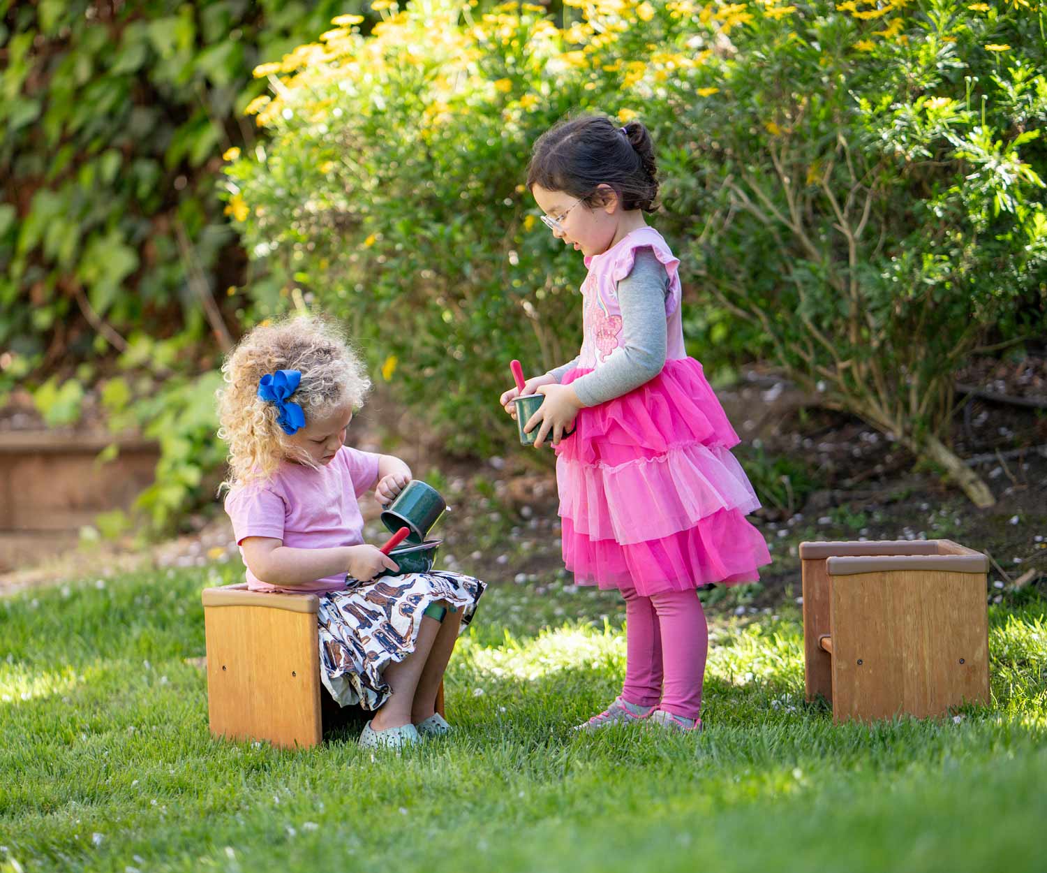 kids playing outdoors with cube chairs