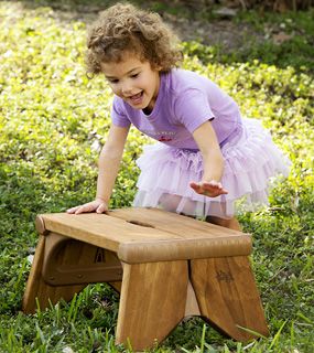 a child climbing on a bench