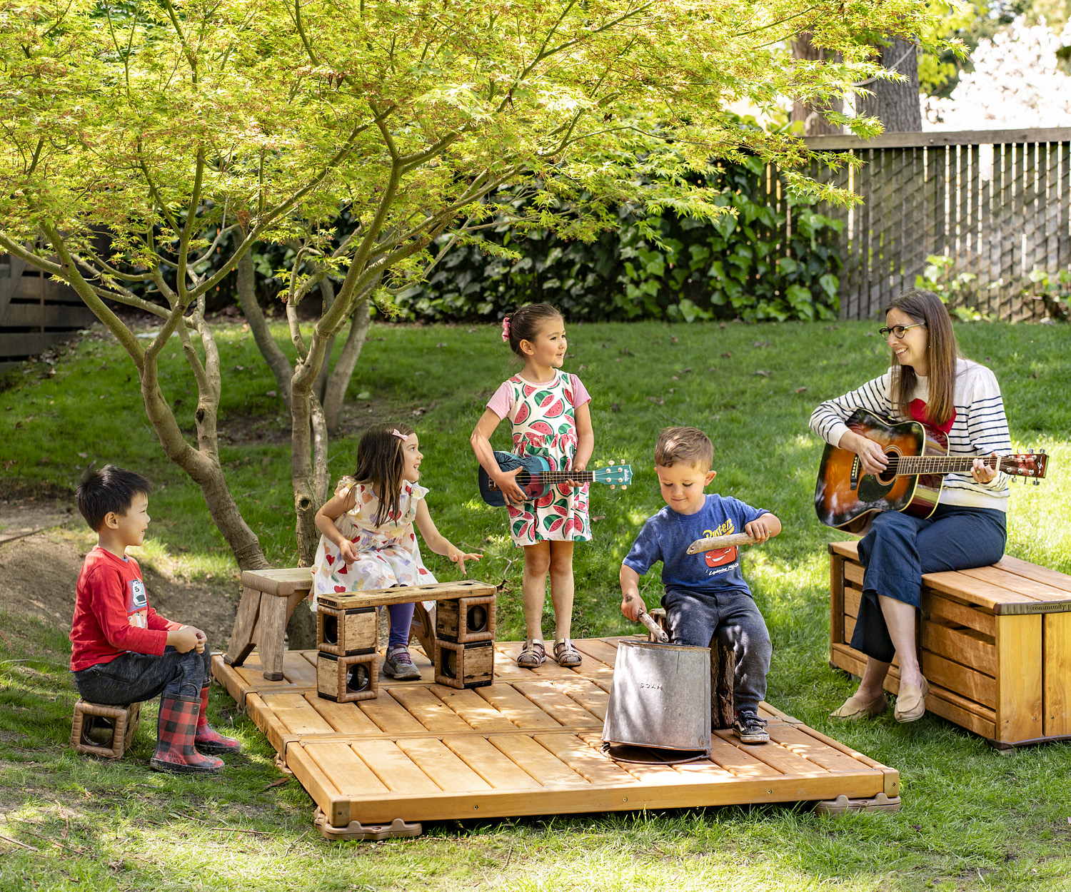 Kids playing musical instruments outdoors