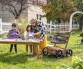 teacher and kids working in outdoor art studio