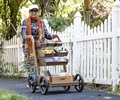 teacher pushing Outdoor art cart