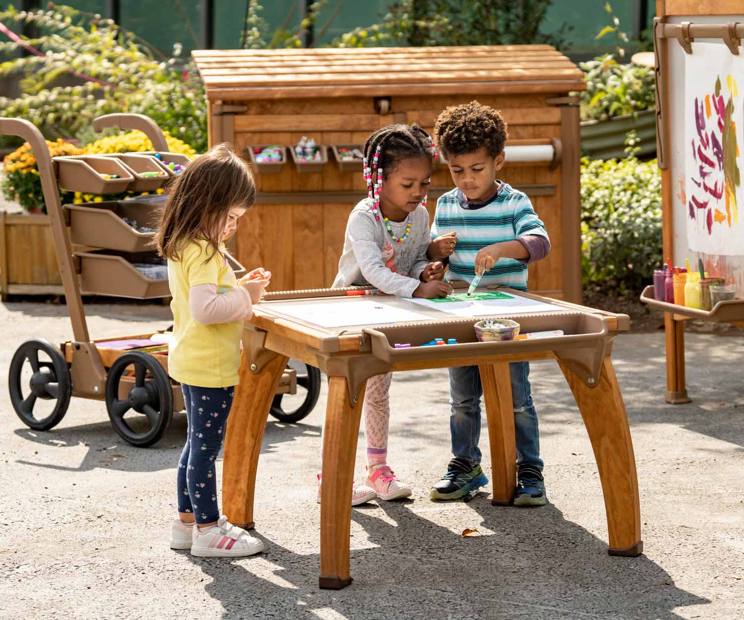 children creating art at small Outlast art table