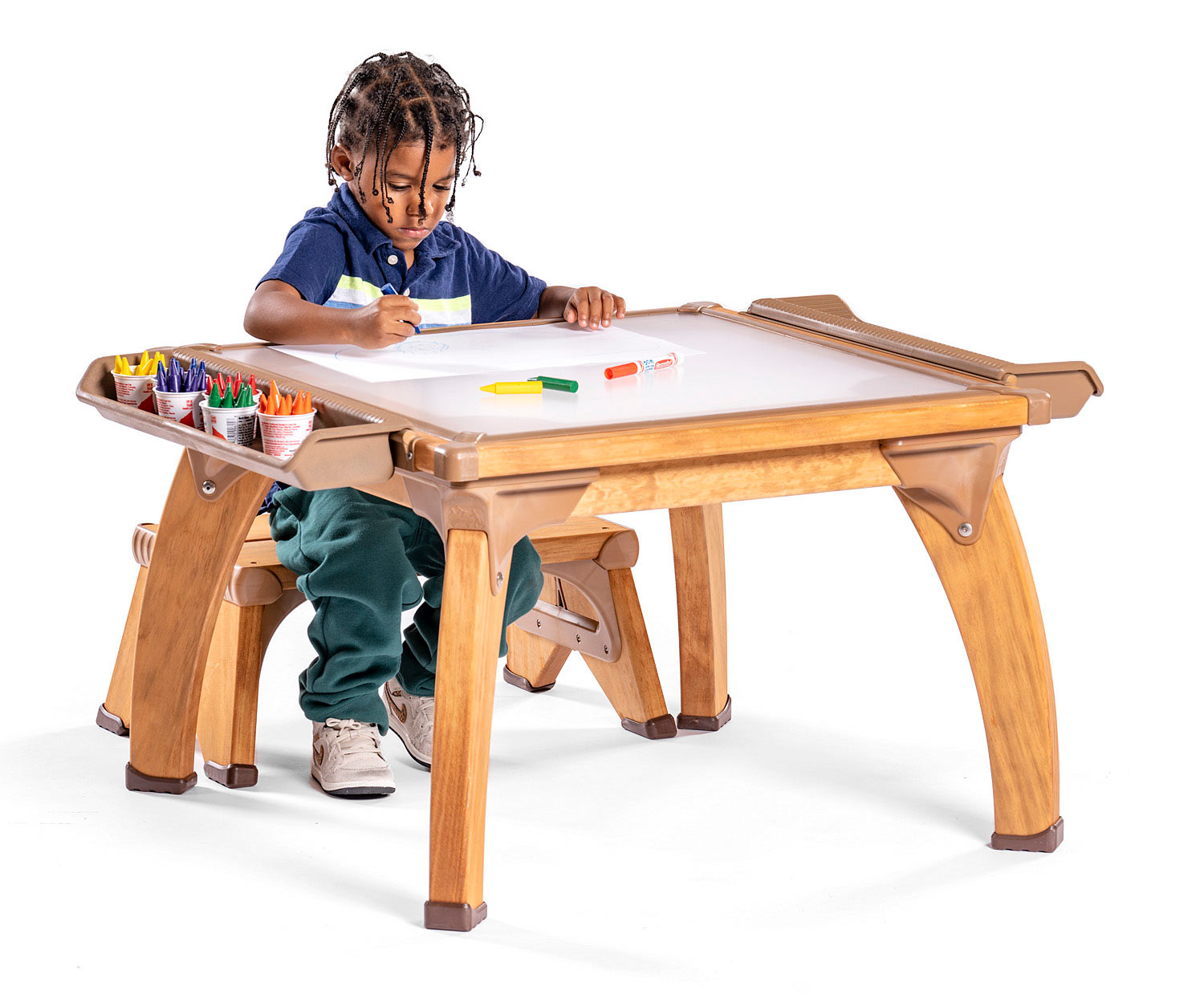 Child seated at Small Outlast art table