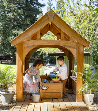 a little girl in a playhouse