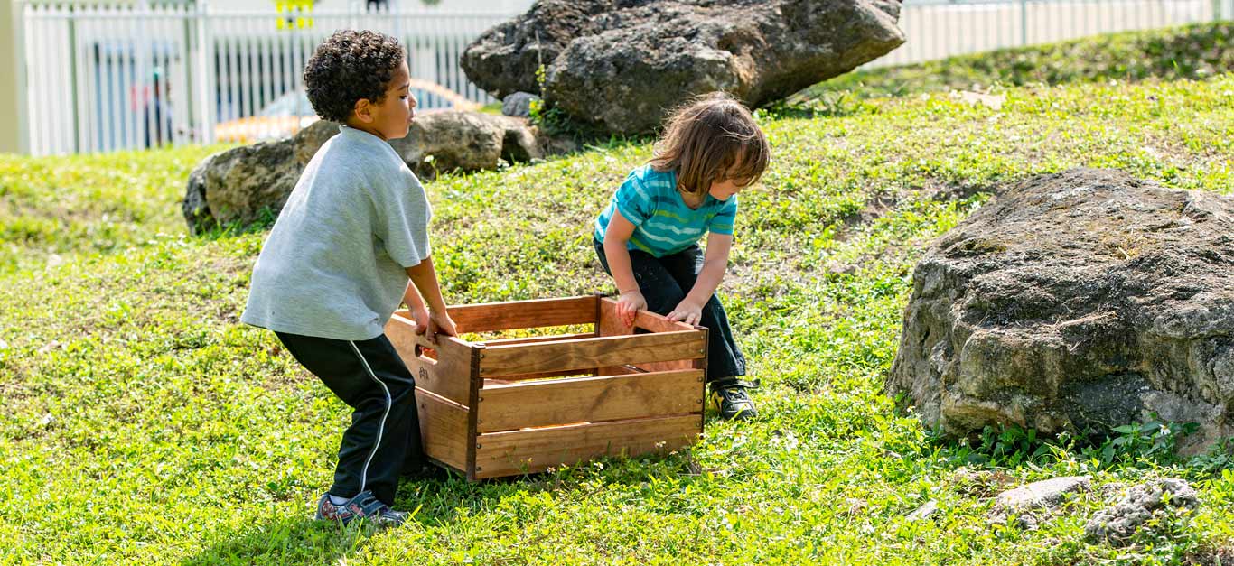 children moving crate outdoors