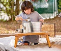 Child playing with Outlast Seat in sandbox