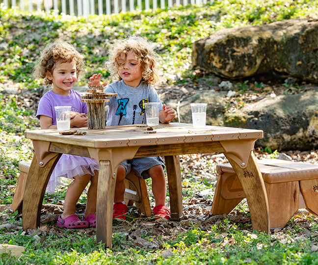 play table in use outdoors toddlers