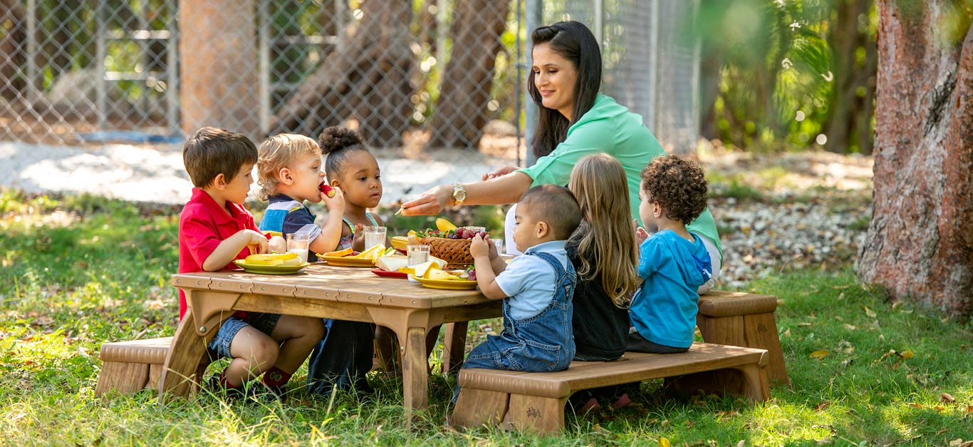 Children having a picnic at Outlast Table set