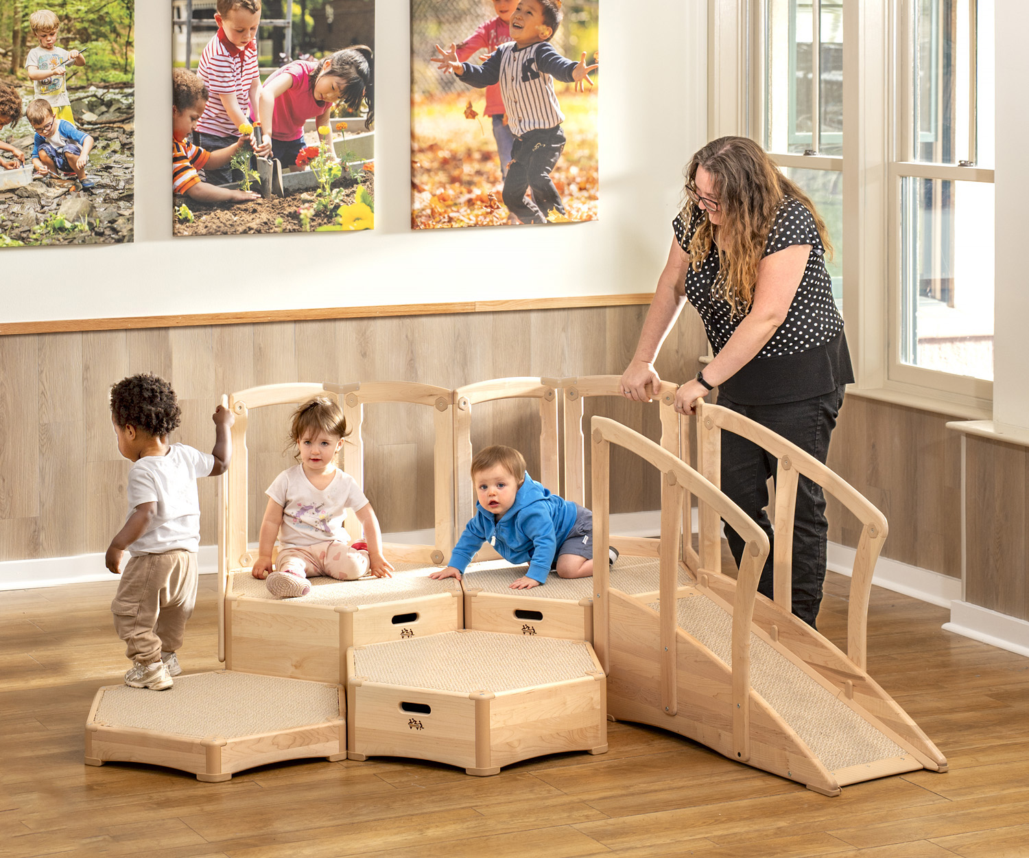 toddler playing on a climbing toy