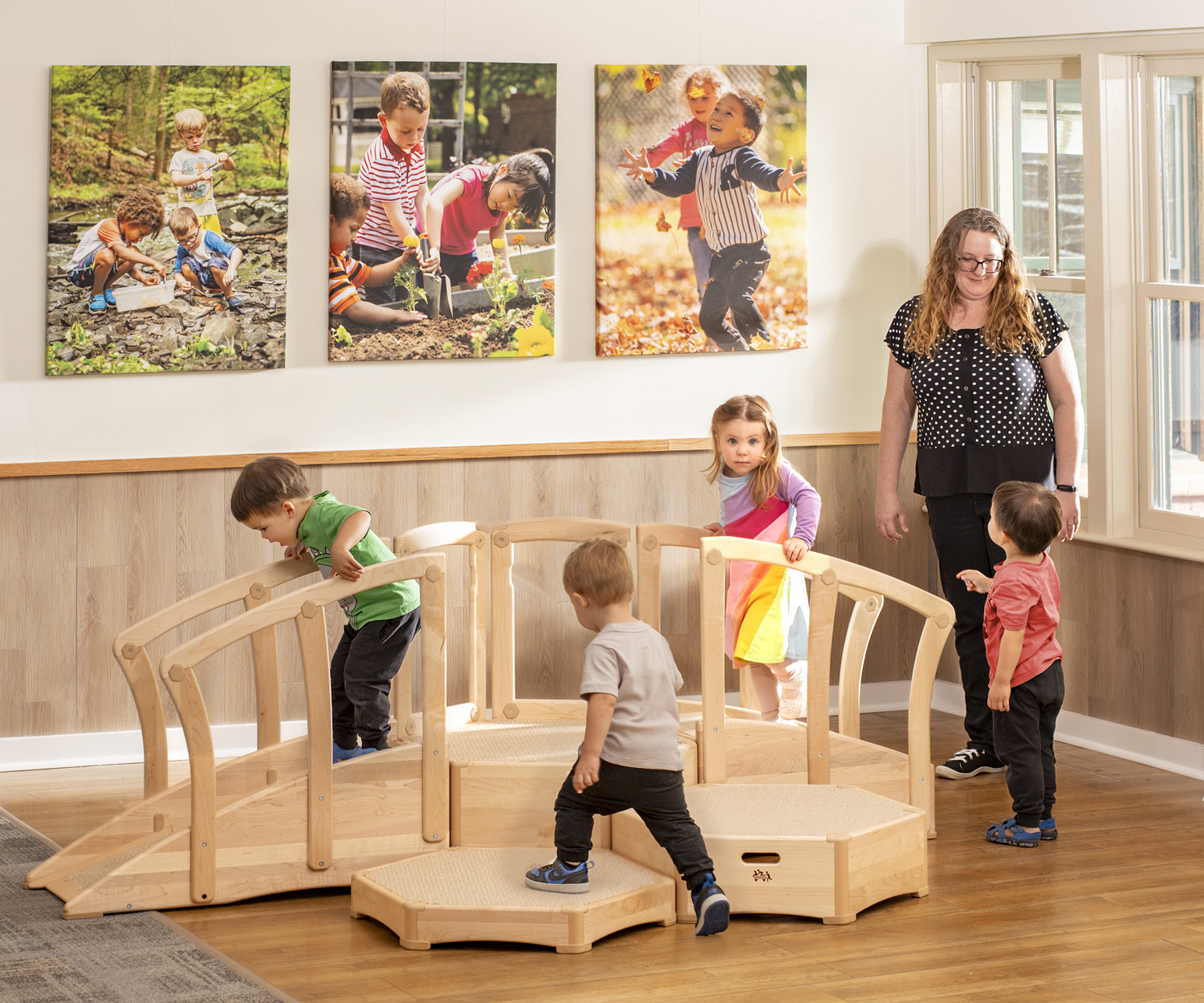 toddlers playing on a climber