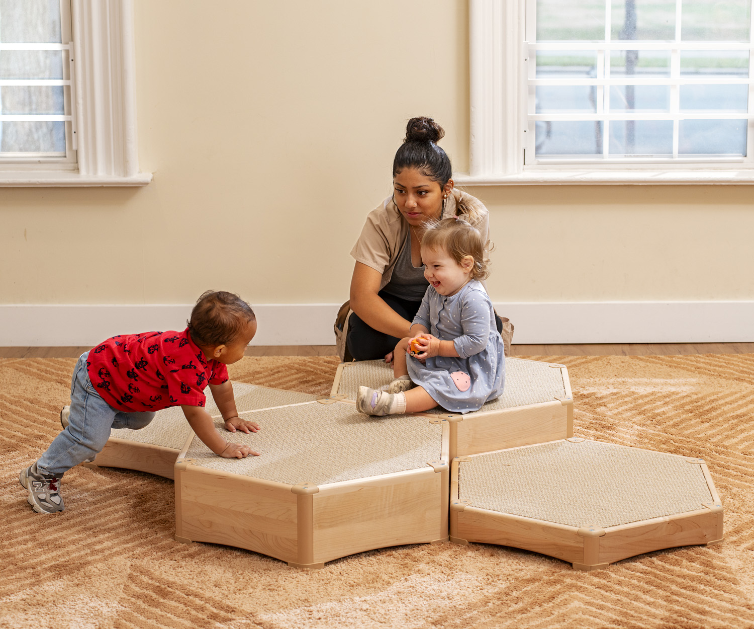 toddlers playing on climbing platforms
