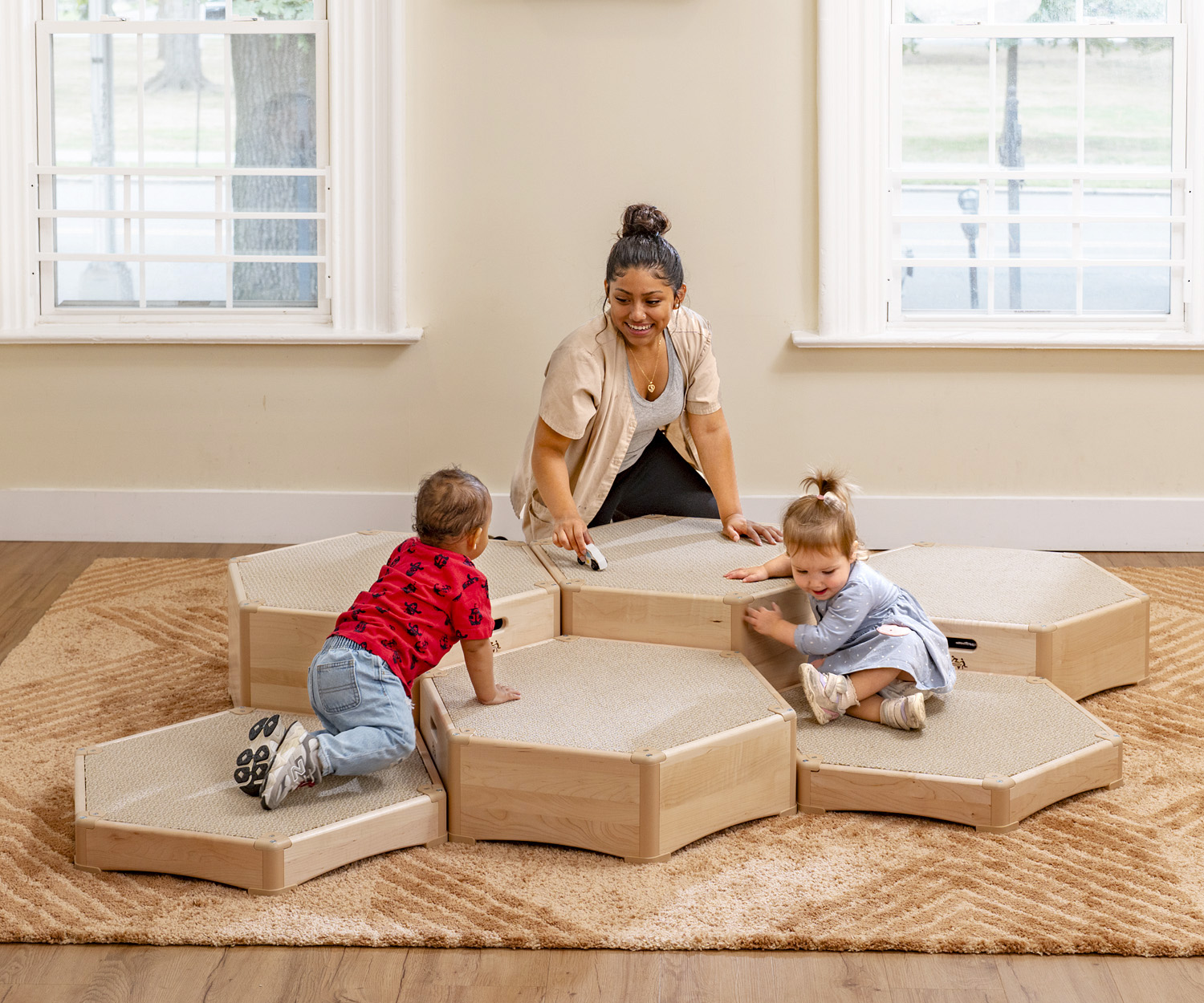 toddlers playing on climbing platforms
