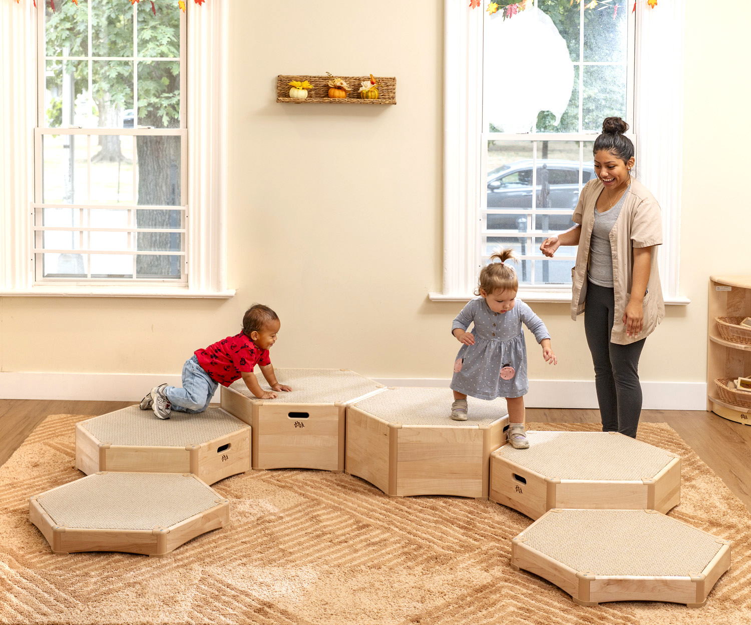 toddlers playing on climbing platforms