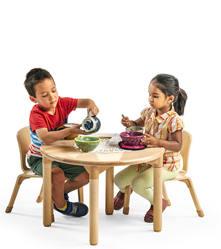 two children sitting around a table