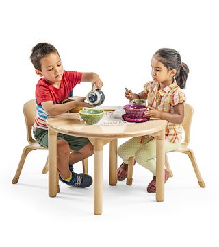 two children sitting around a table