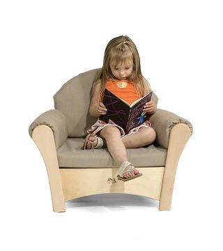 a child reading a book on a small sofa