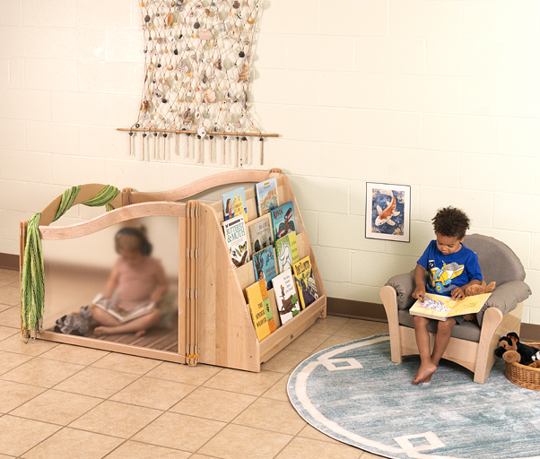 Listening Cube against a wall with a child doing an activity inside it.
