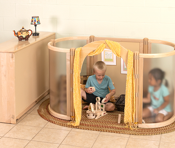 Two children inside a MyCove playing with Mini Unit Blocks.