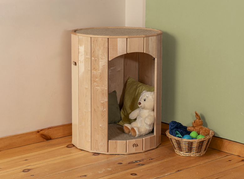 A Calm Nest in a corner with a child playing inside