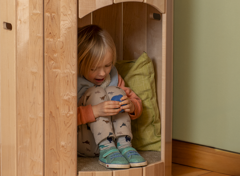 A child playing in a Calm Nest