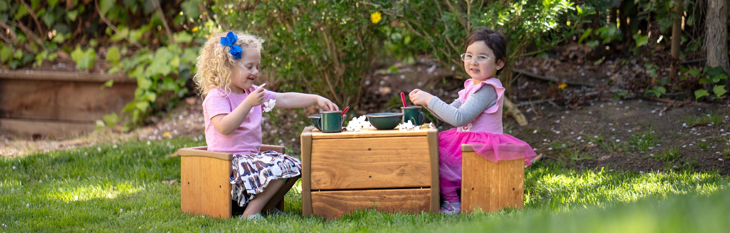 Children engaged in dramatic play with Outlast Cube Furniture set