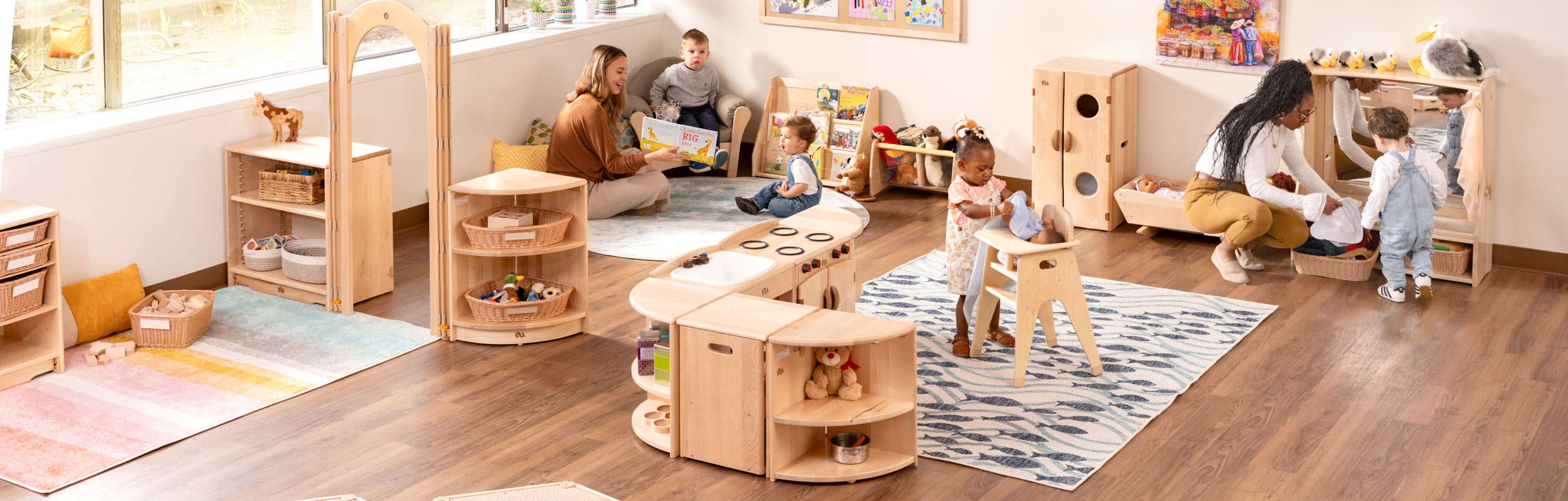 Toddler classroom with Community Playthings maple furniture