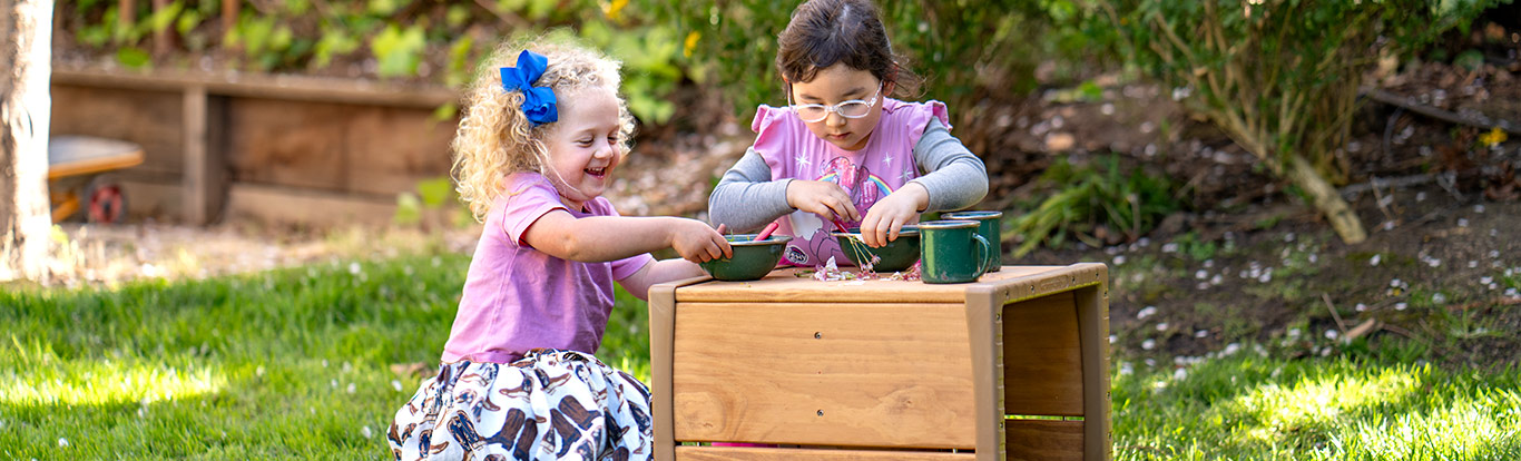 kids playing at outdoor table
