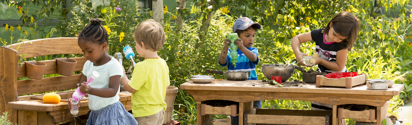 Children playing with the Outlast Mud Kitchen