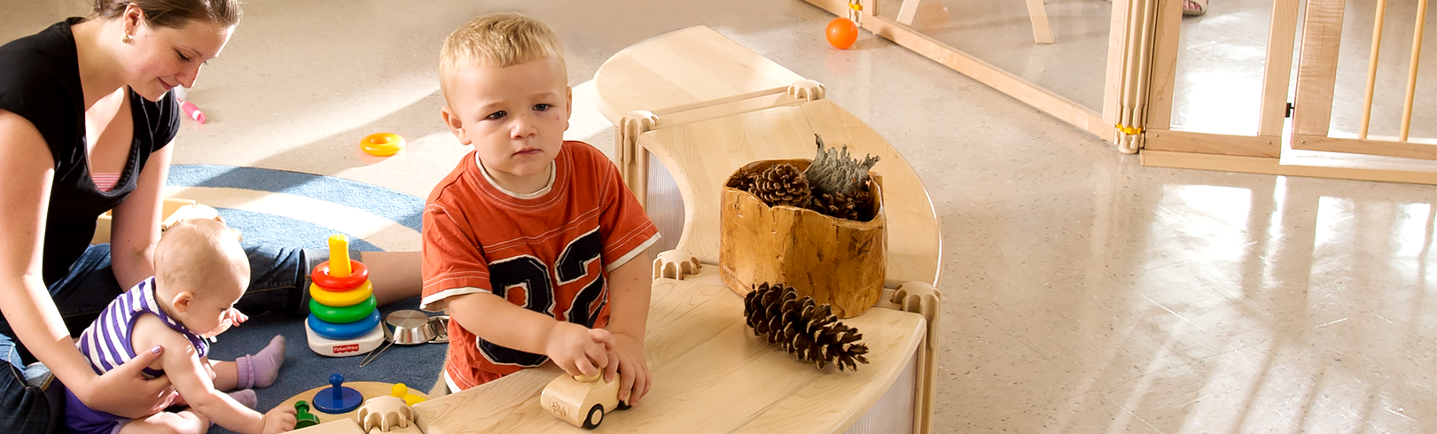 Children playing with Community Playthings furniture