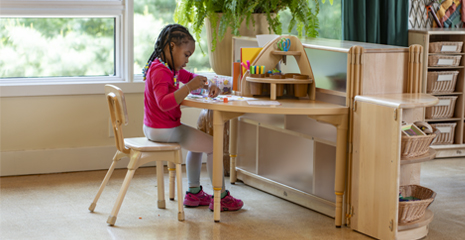child sitting on Classroom chair
