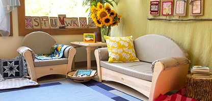 A cosy classroom corner furnished with sofas.