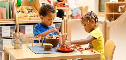 Two children playing in a Community Plaything's Creative Corner.